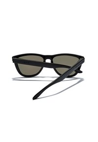 Black sunglasses with a matte finish, sleek design, grey lenses, and branded arms. Features a rounded shape and lightweight frames.
