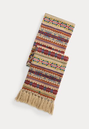 Multicolored woven throw featuring geometric patterns in red, blue, yellow, and green on a beige background, with fringed edges.