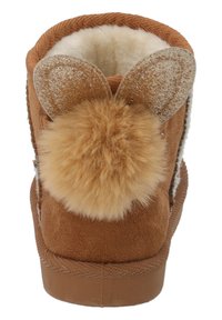 Bruna mockaskinnskängor med beige fuskpälsfoder, med kaninörondetaljer och en fluffig pom-pom på baksidan.