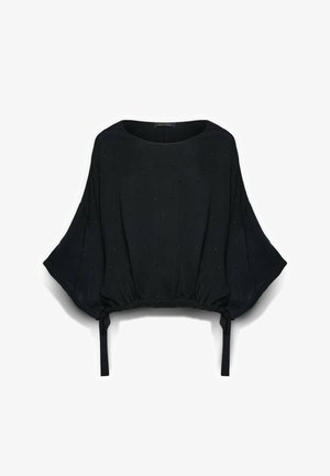 Blusa negra de corte holgado con mangas anchas, textura sutil de puntos, escote redondo y cordones ajustables en el dobladillo.