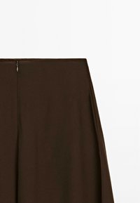 Dark brown skirt with a back zipper closure displayed on a plain white background.
