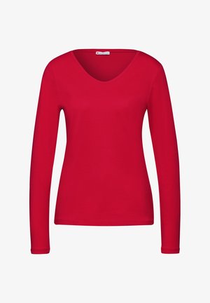 Rød langærmet skjorte med V-hals, lavet af blødt stof. Har et figursyet design og ren syning langs manchetter og kant.