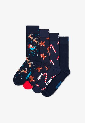Quatre paires de chaussettes bleu marine avec des motifs festifs, comprenant des rennes, le Père Noël, des bonshommes en pain d'épice et des cannes en sucre d'orge, avec une chaussette accent rouge.
