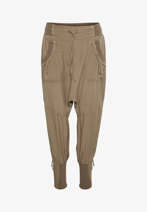 Jasnobrązowe, casualowe spodnie z elastycznym pasem, regulowanym sznurkiem, dużymi przednimi kieszeniami oraz ściągaczami przy kostkach.