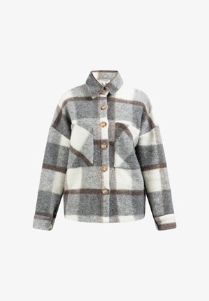 Plaid flannel shirt in grey, white, and brown. Features a button front, collar, and two chest pockets. Soft texture with a loose fit.