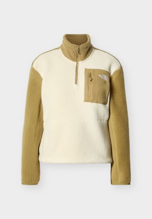 Polaire en écru et beige avec demi-fermeture éclair, col montant et poche zippée avant. Tissu texturé et manches contrastées.