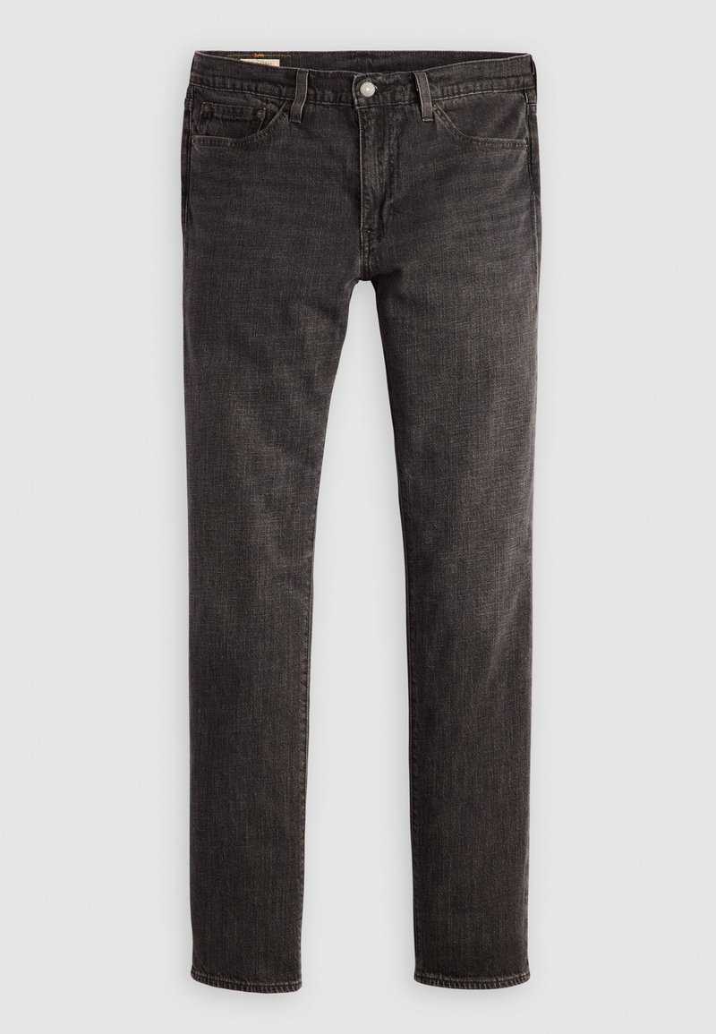 Jeans de mezclilla negros con corte slim, que presentan un diseño de cinco bolsillos, botón de latón y una textura sutil. Sin patrones visibles ni adornos adicionales.