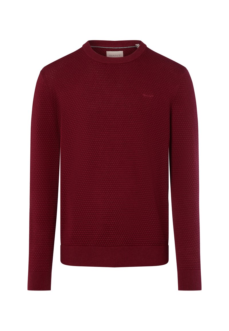 Bordeaux gebreide trui met een textuurpatroon, ronde halslijn en lange mouwen. Subtiele merklogo op de borst, geribde boorden en onderrand.