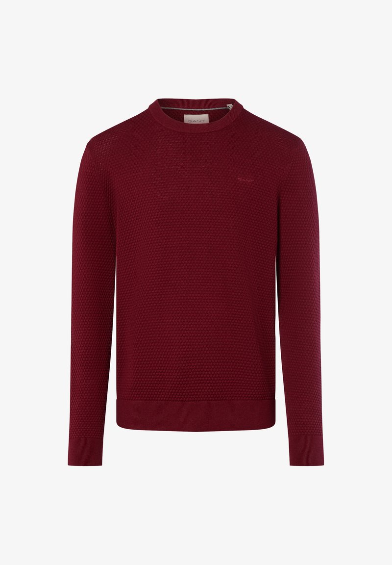 Bordeaux gebreide trui met een textuurpatroon, ronde halslijn en lange mouwen. Subtiele merklogo op de borst, geribde boorden en onderrand.