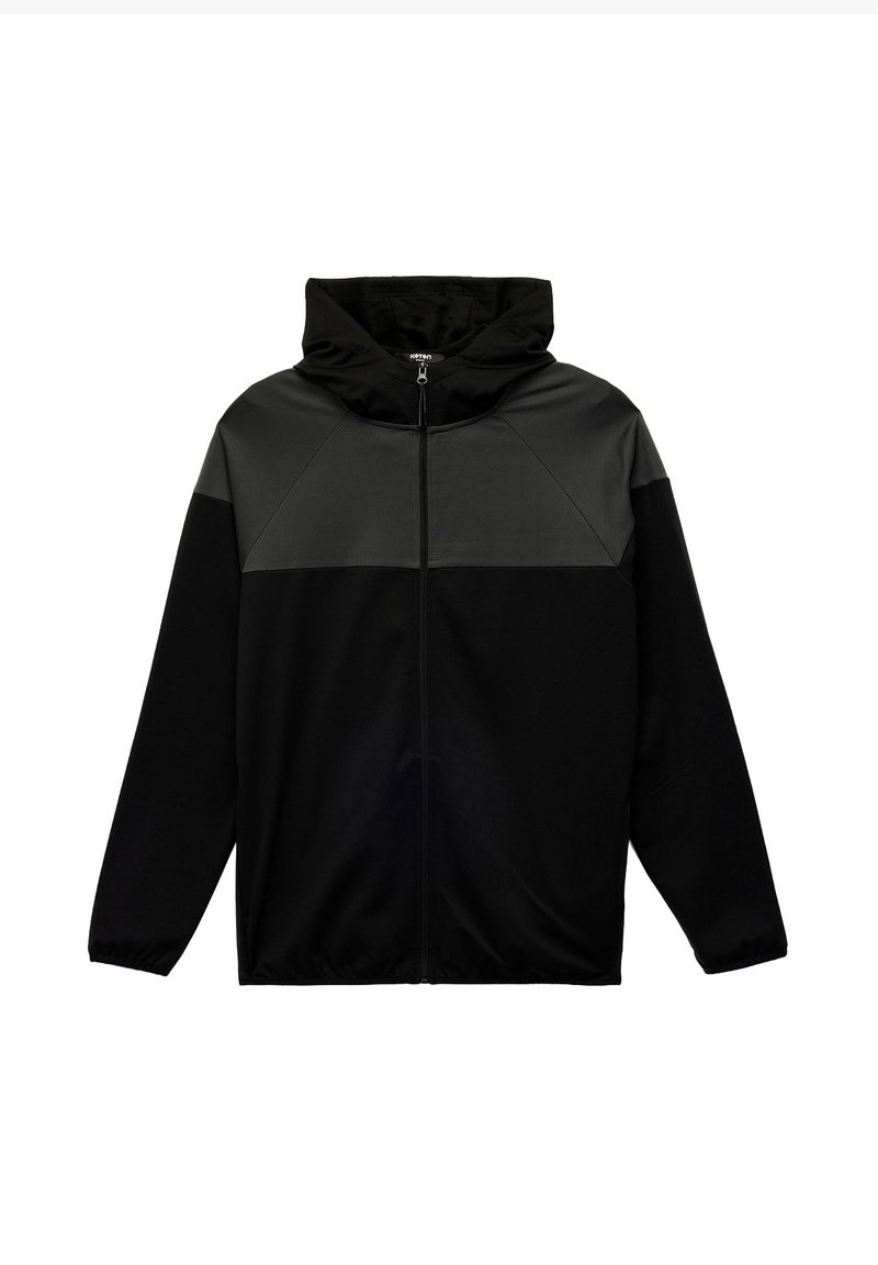 Sort zip-up hoodie med et gråt panel over brystet. Har hætte, lange ærmer og elastiske manchetter. Blød stoftekstur.