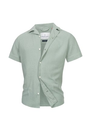 Short-sleeve, light green button-up shirt. Made of textured fabric with a subtle check pattern. Features a collar and front pocket.
