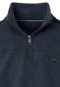 Marineblauwe longsleeve pullover met een kwart rits. Gelaagd stof met een glad bovenste gedeelte. Etiket toont maat "L" en merk "CASA MODA."