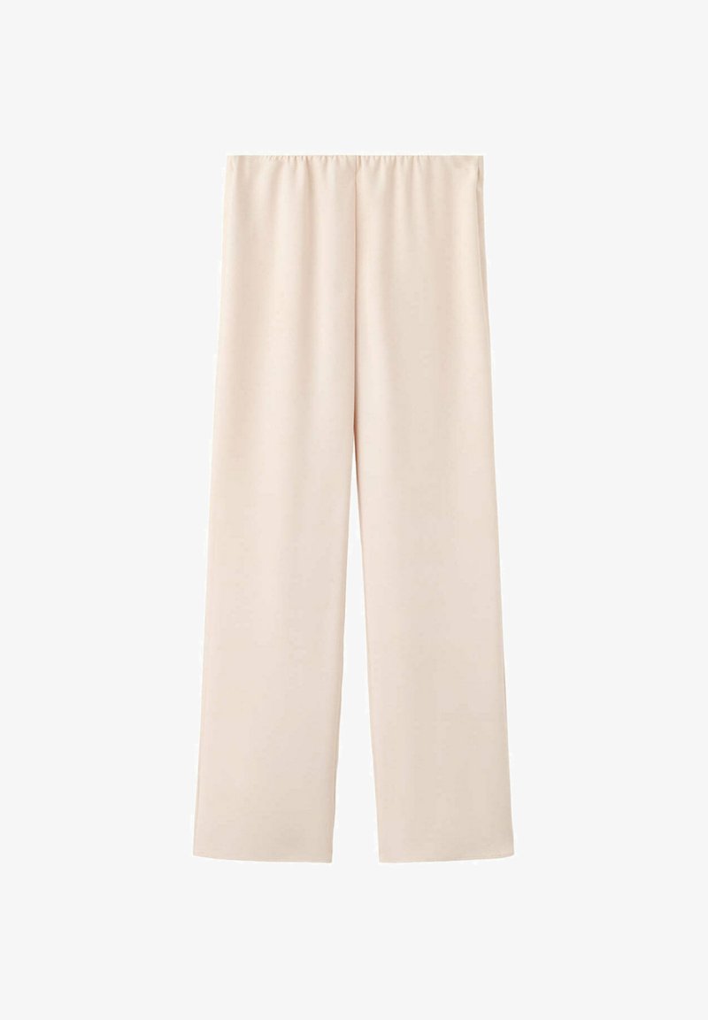 Pantalon large couleur crème avec ceinture élastique, présenté à plat sur fond blanc.