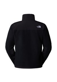Black fleece jacket with a high collar, featuring a solid black upper panel and logo on the back. Textured material with a smooth lower layer.