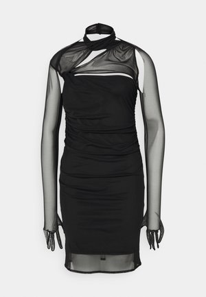 Black dress with sheer mesh long sleeves, asymmetrical neckline, ruched body, and a form-fitting silhouette. Transparent accents and hem.