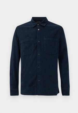 Navy blue corduroy shirt with long sleeves, button-down collar, two chest pockets, and front button closure. Textured fabric with visible ribs.