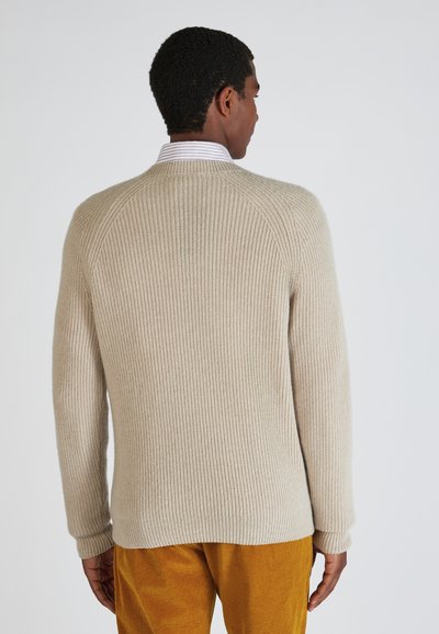 Beige ribbed Strickpullover mit langen Ärmeln und Rundhalsausschnitt. Verfügt über einen strukturierten Stoff und Rippdetails an den Bündchen und am Saum.