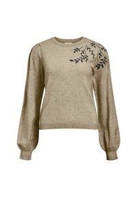 Helle beige Pullover mit langen Puffärmeln, geripptem Saum und schwarzem gesticktem Blattdesign auf der linken Schulter. Weiche Textur.