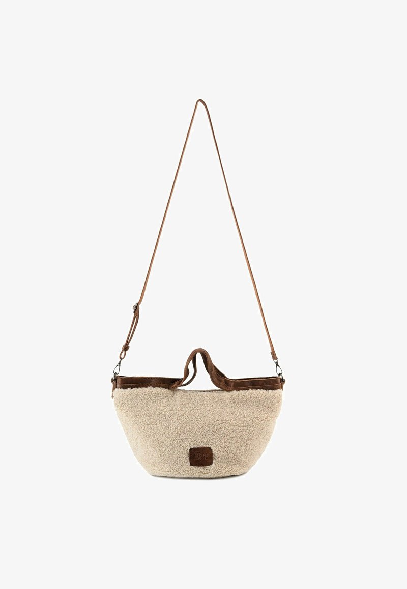 Helle beigefarbene Tasche mit einer strukturierten, flauschigen Oberfläche und dunkelbraunen Lederelementen. Verfügt über einen kurzen Griff und einen verstellbaren Schultergurt.