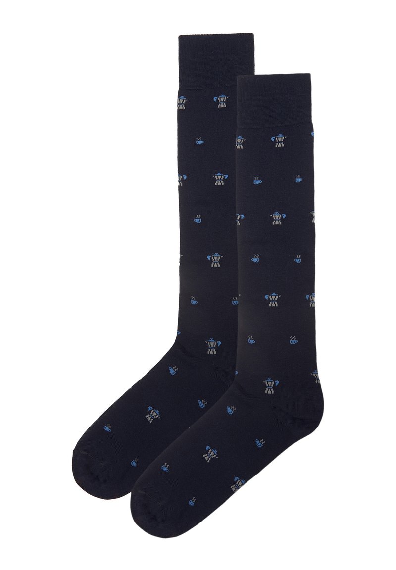 Calze marine con motivi decorativi di teiere e tazze blu e grigie. Texture liscia con polsini a coste; design al ginocchio.