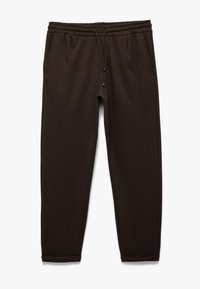Brune svedbukser med elastisk talje, snor, to sidelommer, tapered ben og ribbede hæmser. Blød stoftekstur.