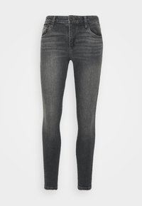 Skinny jeans in dark gray denim, featuring a mid-rise waist, five pockets, and subtle whiskering for texture. Smooth fabric with minimal design.
