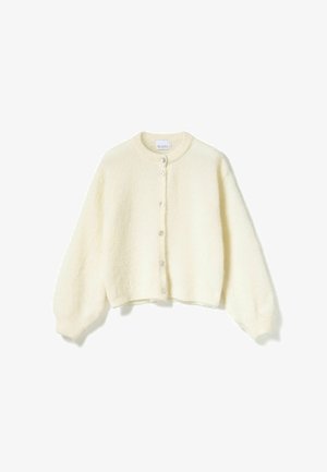Kremowy, krótkotrwały kardigan wykonany z miękkiego, puszystego materiału. Posiada okrągły dekolt, zapięcia na guziki z przodu oraz balonowe rękawy.