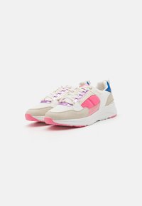 Sneakers with a cream mesh upper, pink and purple accents, white sole, and a blue heel tab. Features lace-up design and contrasting textures.
