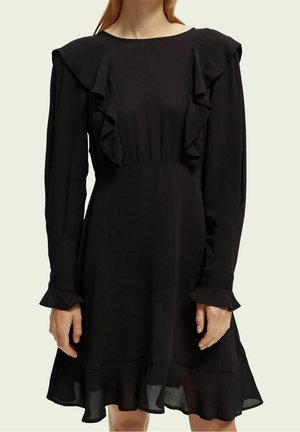 Black dress with long sleeves, ruffled neckline and cuffs, fitted waist, and a flared hem. Made of lightweight, smooth fabric.