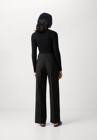 Scotch & Soda CORE EDIE - Housut - black