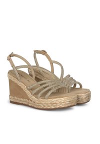 Sandali con zeppa beige con suola in juta intrecciata, dotati di cinturini incrociati adornati da strass e di una comoda soletta.