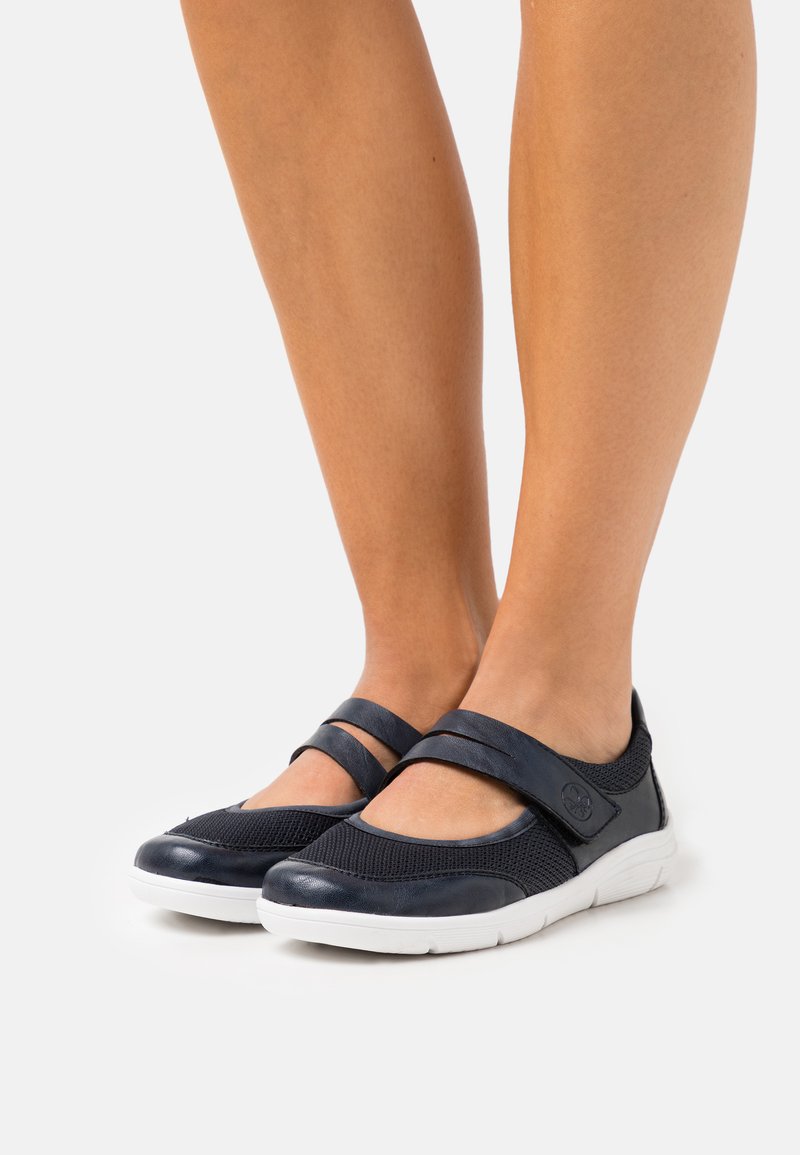 Navy blue Mary Jane-style shoes with mesh fabric and leather accents; features a dual strap design and white rubber soles.