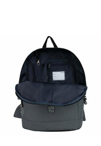 Gray fabric backpack with a navy interior, zippered closure, front pocket with a name tag, and adjustable straps. Interior includes compartments.