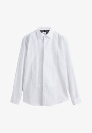 Chemise blanche avec un panneau avant plissé, un col pointu et des manches longues. Fabriquée en tissu lisse avec des poignets à boutons.