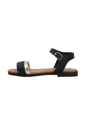 Black sandal with an ankle strap, metallic gold band across the toe, flat sole, and a smooth leather-like finish.