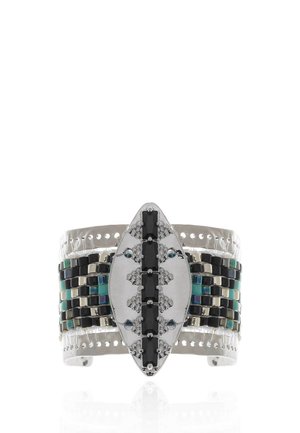 Silver cuff bracelet with central marquise shape set with black stones and black, silver, and blue-green square beads on the band.