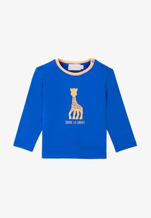 Camicia a maniche lunghe blu realizzata in morbido cotone, con stampa di una giraffa arancione e il testo "Sophie La Girafe" sotto. Include chiusura a scatto.