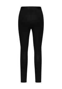 Leggings noirs en tissu extensible au design ajusté, dotés d'une taille lisse et de poignets de cheville, idéaux pour le sport.