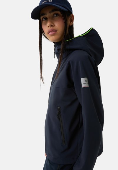 Navy waterproof jacket with a hood, featuring a front zip and a side pocket. Green accents on the hood, and a logo patch on the sleeve.