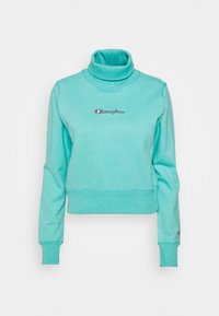 Sweatshirt cropped turchese con colletto alto, dotato di polsini e orlo a costine. Presenta un piccolo logo ricamato sul petto.