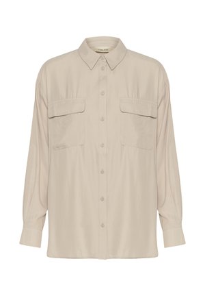 Bež bluzica od glatke tkanine s ovratnikom, dugmadi i dva džepa na grudima. Ima duge rukave i ležeran kroj.