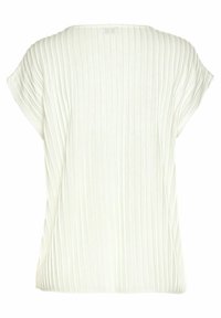 Off-white ribbat topp med kort ärm, bred halsringning och lös passform, sedd bakifrån mot en neutral bakgrund.