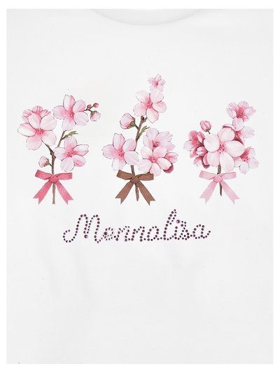 T-shirt blanc avec trois bouquets de fleurs roses ornés de nœuds, et le texte "Mennola" en strass en dessous des motifs.