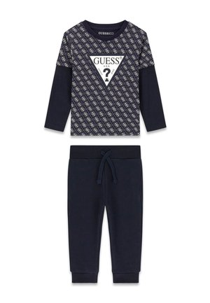 Ensemble enfant deux pièces bleu marine avec haut à manches longues à motifs comprenant le logo Guess et pantalon uni à cordon avec poignets côtelés.