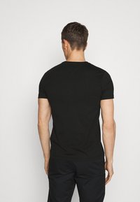 Tommy Hilfiger Triko s potiskem - black