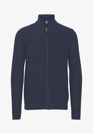 Mørkeblå hettegenser med glidelås, med en strukturert strikkedesign, høy krage, og ribbestrikkede mansjetter og kant. Glatt glidelåsdetalj foran.