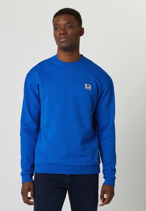 Blauwe sweatshirt van een katoenmix met een ronde halslijn, ribgebreide mouwen en zoom. Bevat een kleine merkpatch op de borst.