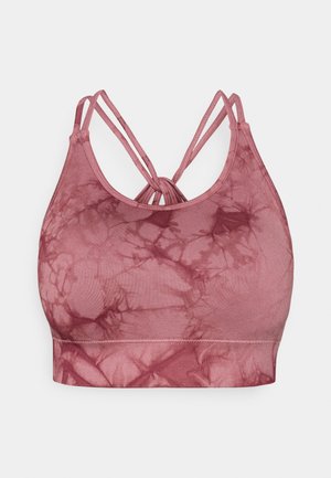 Brassière de sport tie-dye mauve avec une texture lisse, un design dos à lanières et une bande élastique en bas pour le maintien.