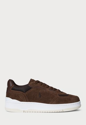 Brown suede sneaker with mesh accents, round toe, elevated white midsole, and lace-up front. Features logo detailing on side and tongue.