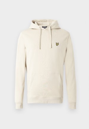 Φούτερ με κουκούλα σε κρεμ απόχρωση, κατασκευασμένο από απαλό ύφασμα, με μπροστινή τσέπη καγκουρό και ένα μικρό κίτρινο έμβλημα στο στήθος. Περιλαμβάνει κουκούλα με κορδόνι.